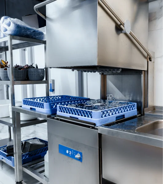 A commercial kitchen with a dishwasher.